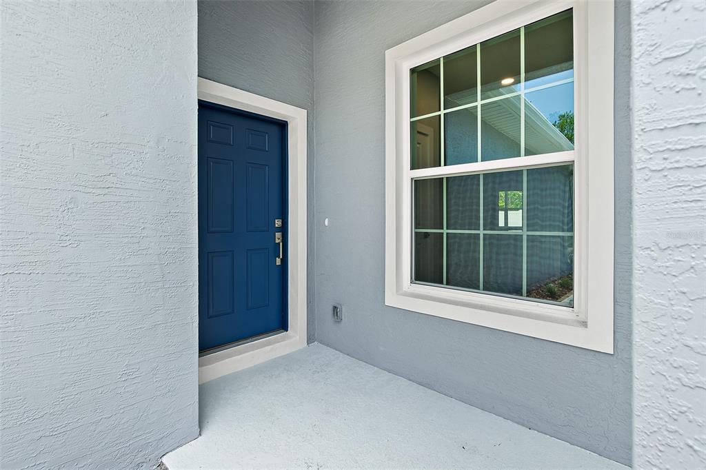 13 Karas Trail Palm Coast, FL 32164 - Photo 4 of 37 a view of an empty room with a window