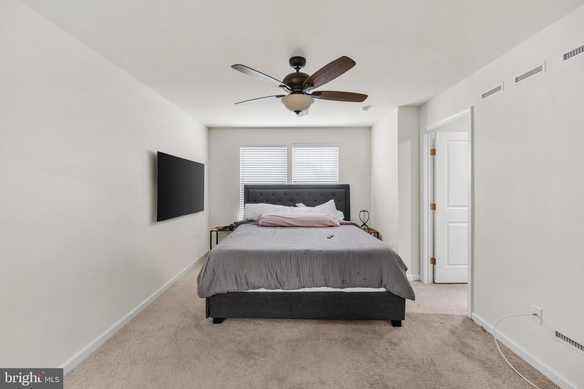 39 Nelsons Way Westampton, NJ 08060 - Photo 20 of 23 a spacious bedroom with a bed and a chandelier