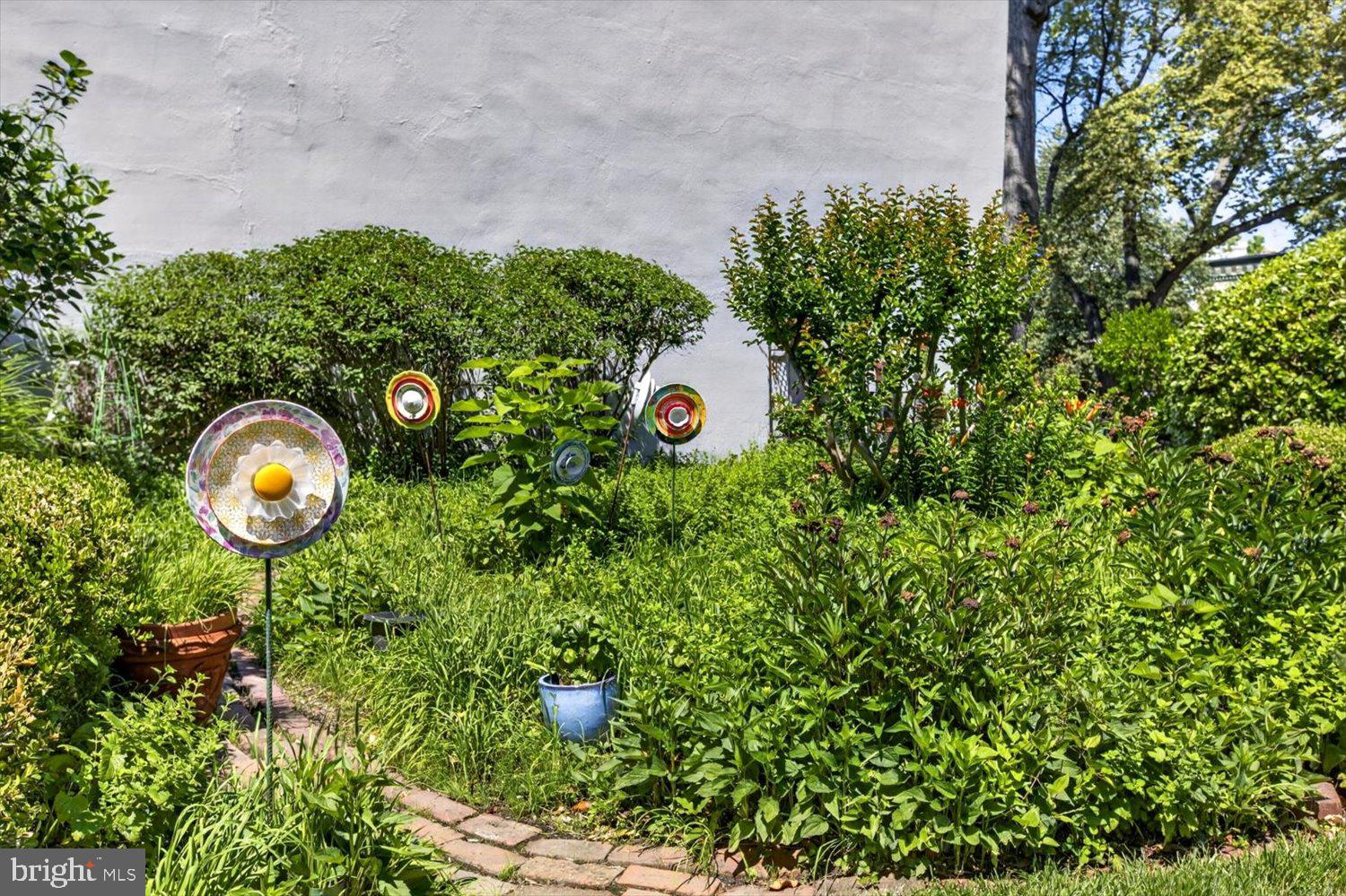 410 5th Street Northeast, Unit 1 Washington, DC 20002 - Photo 35 of 37 Whimsical garden with vibrant decor.