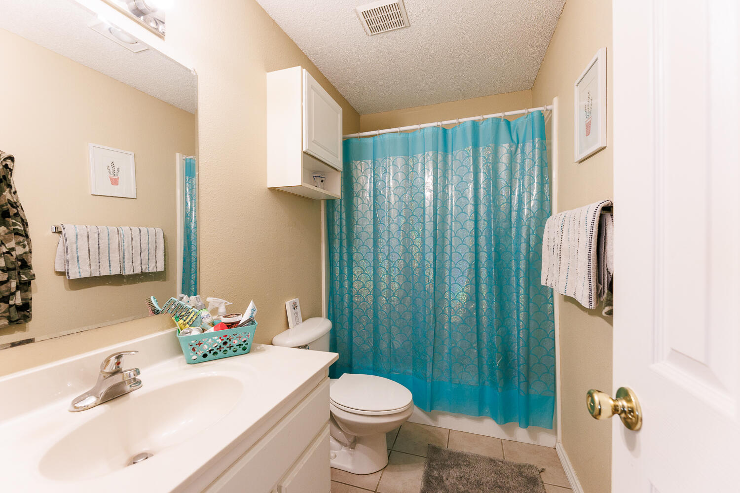 3416 97th Street Lubbock, TX 79423 - Photo 13 of 14 a bathroom with a sink toilet and shower