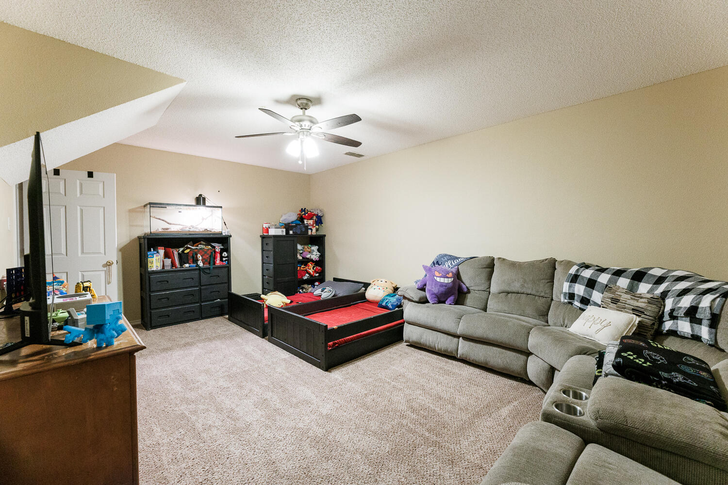 3416 97th Street Lubbock, TX 79423 - Photo 14 of 14 a living room with furniture and a fireplace