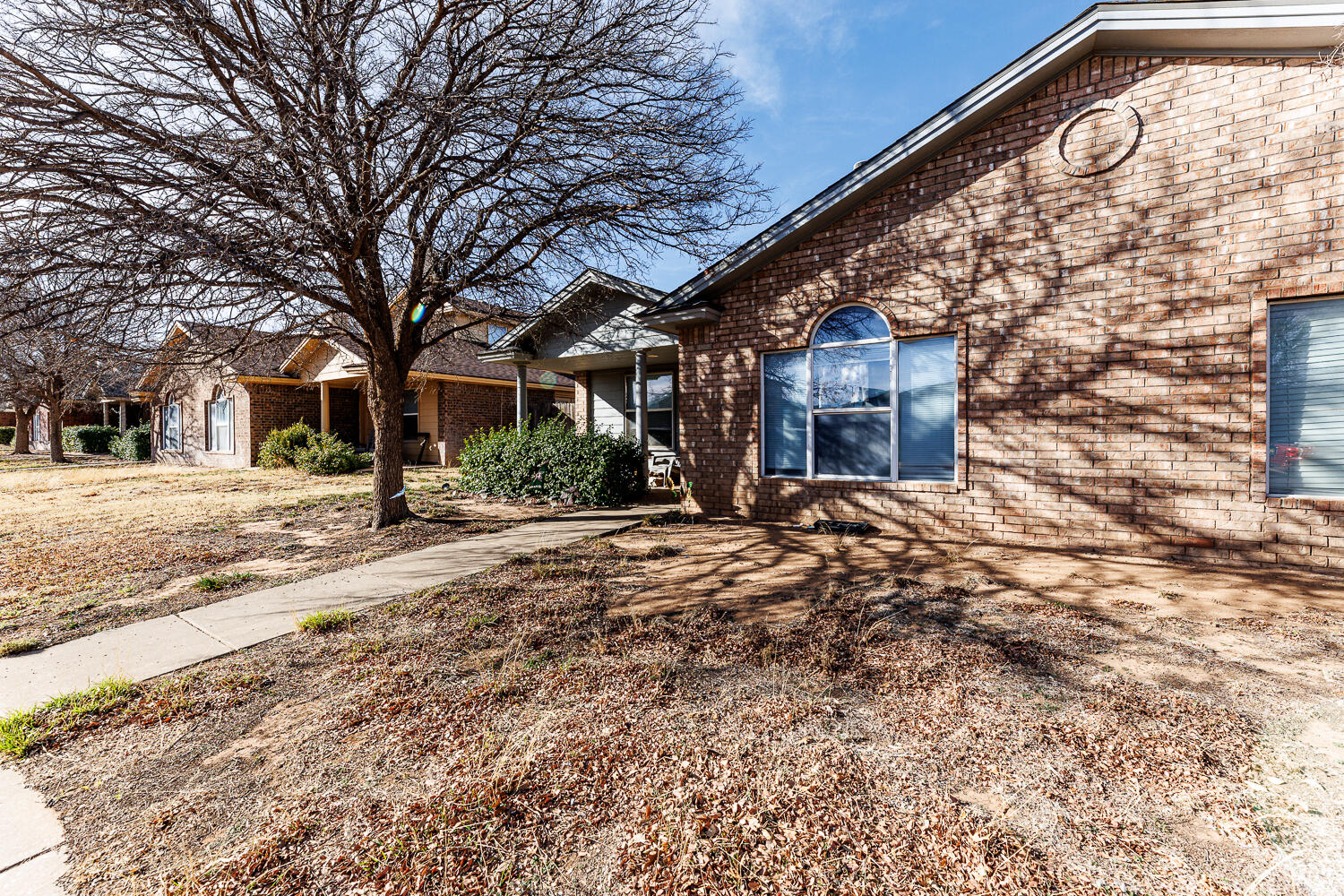 3416 97th Street Lubbock, TX 79423 - Photo 2 of 14 a view of a building with a yard
