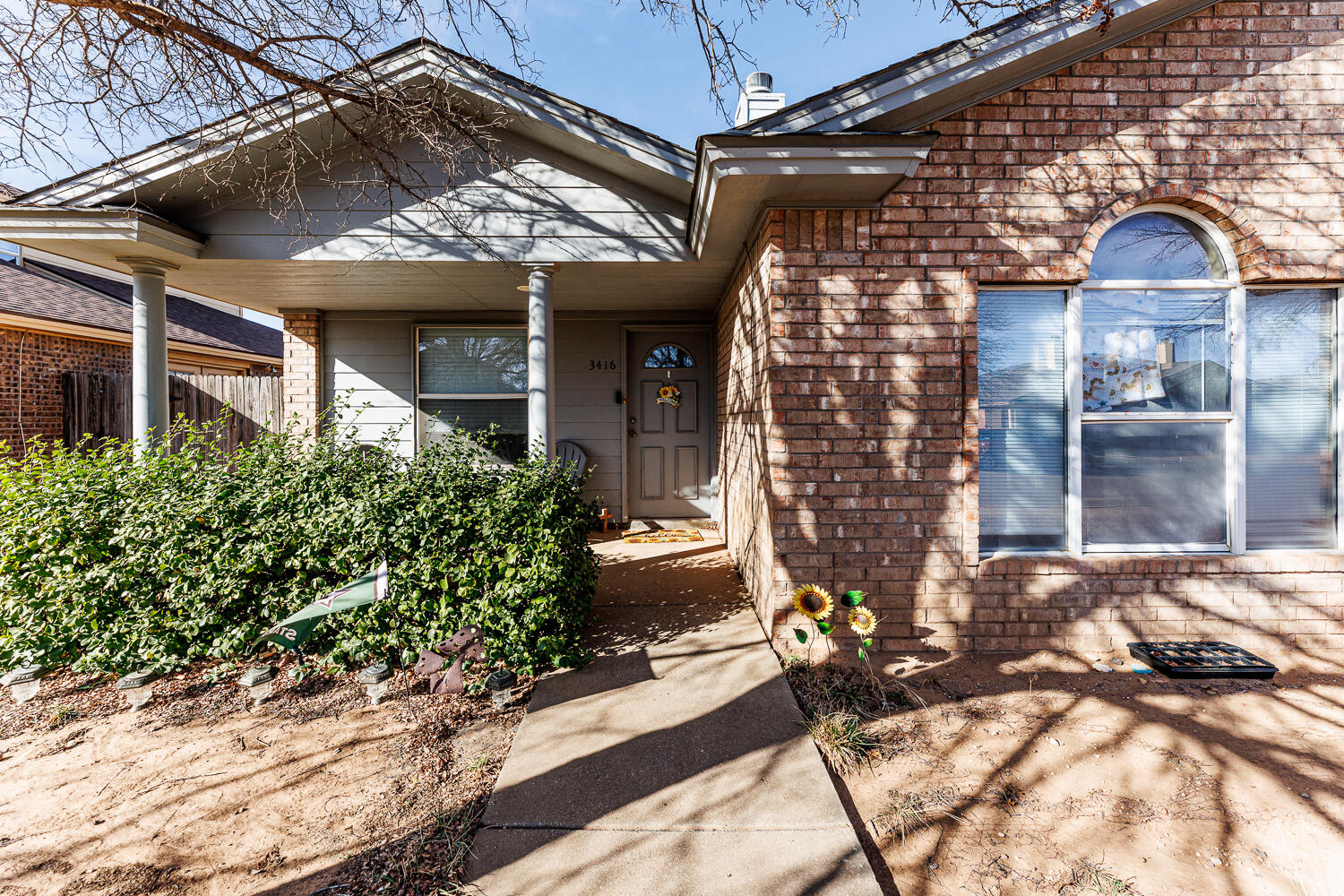 3416 97th Street Lubbock, TX 79423 - Photo 3 of 14 a view of a house with a yard
