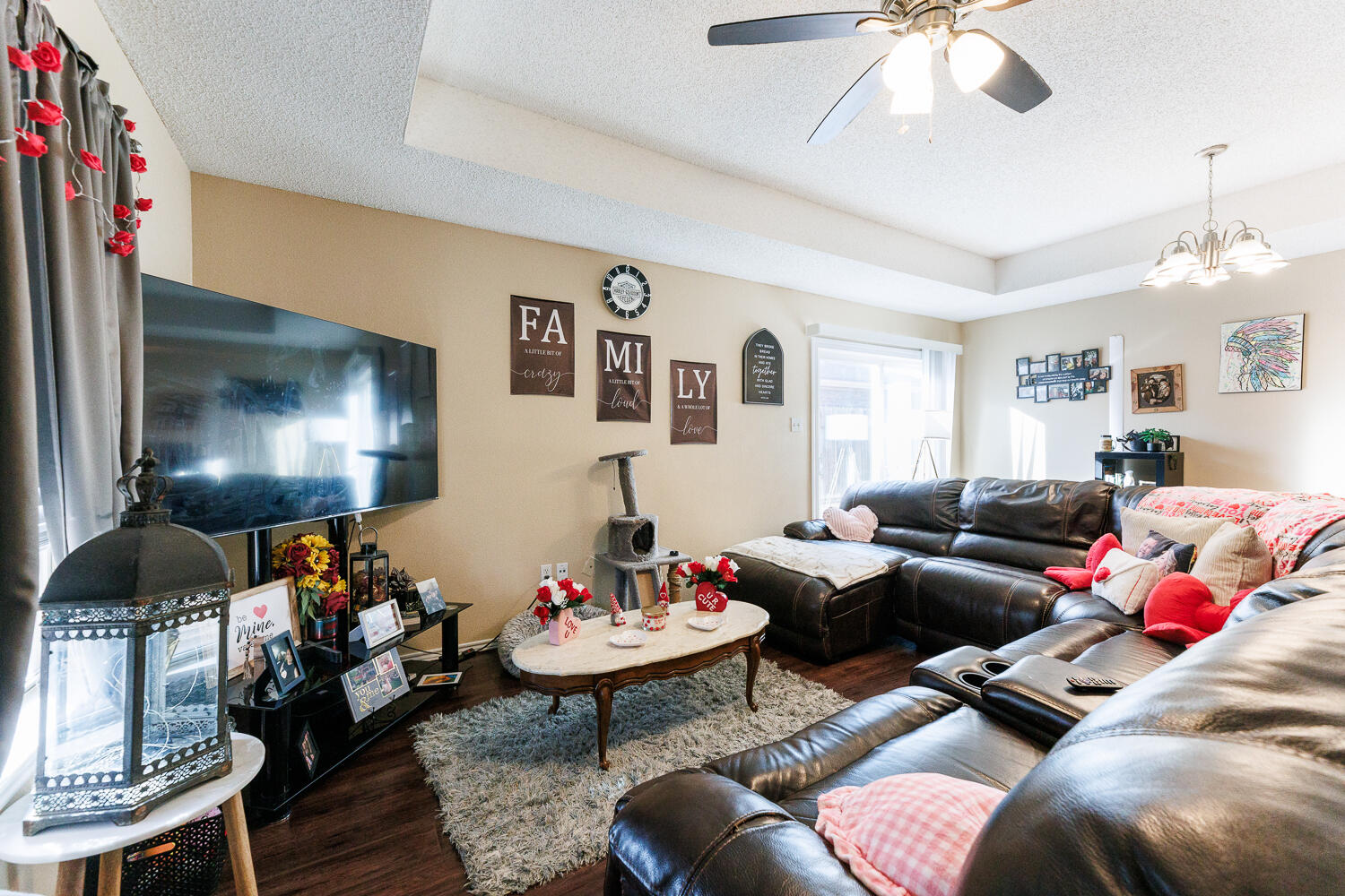 3416 97th Street Lubbock, TX 79423 - Photo 7 of 14 a living room with furniture and a chandelier