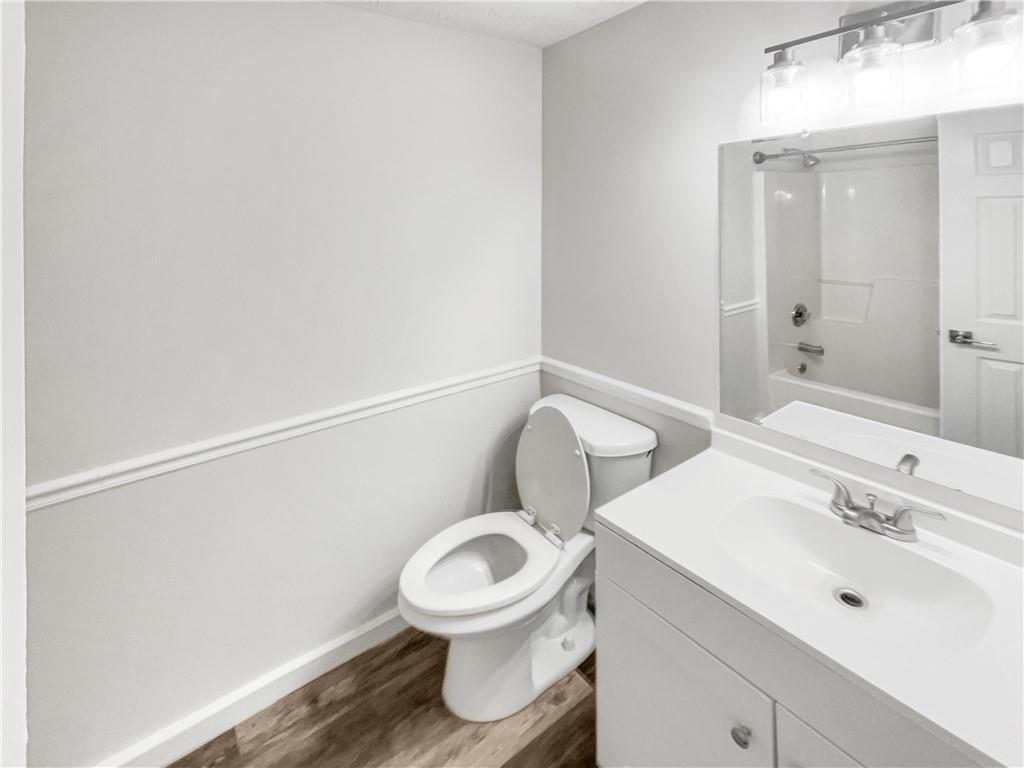 24 Chelsea Lane Grantville, GA 30220 - Photo 15 of 20 a white toilet sitting next to a bathroom sink