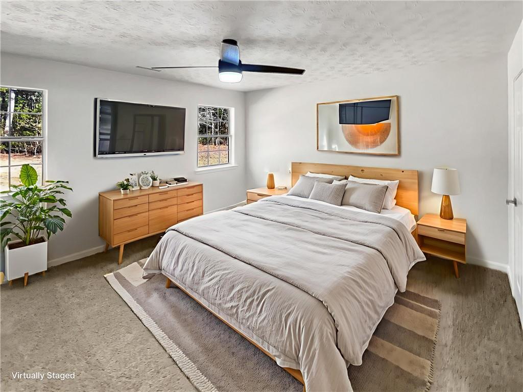 24 Chelsea Lane Grantville, GA 30220 - Photo 9 of 20 a bedroom with double bed and a flat screen tv