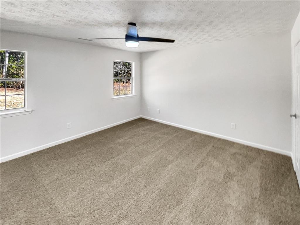 24 Chelsea Lane Grantville, GA 30220 - Photo 10 of 20 a view of an empty room with a window