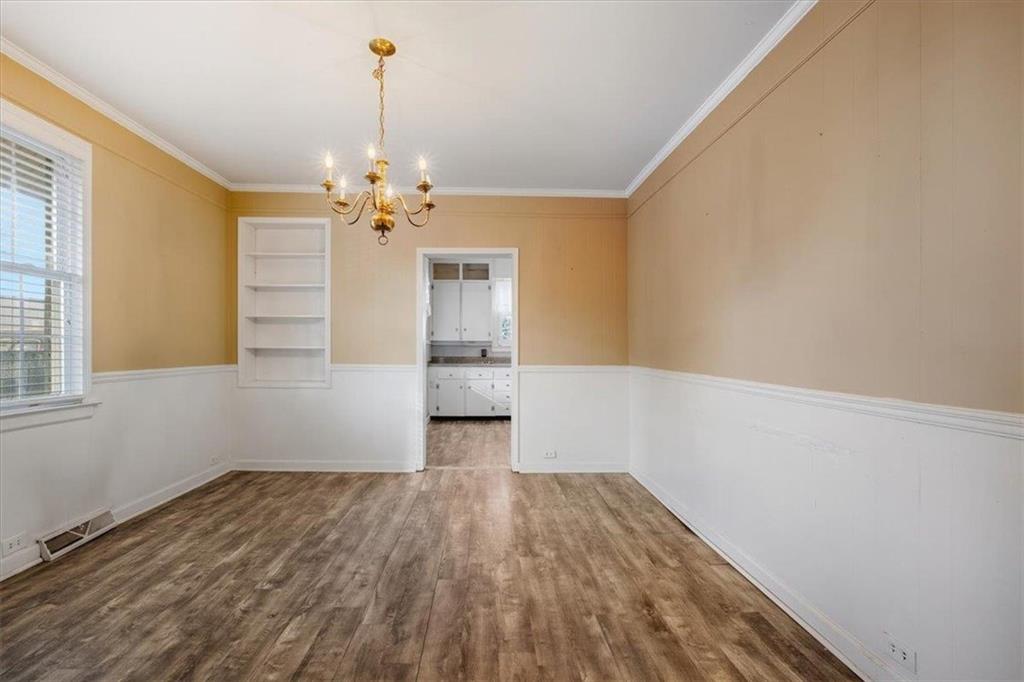 1 Poplar Street Northeast Rome, GA 30161 - Photo 11 of 28 a view of a room with wooden floor chandelier and a window