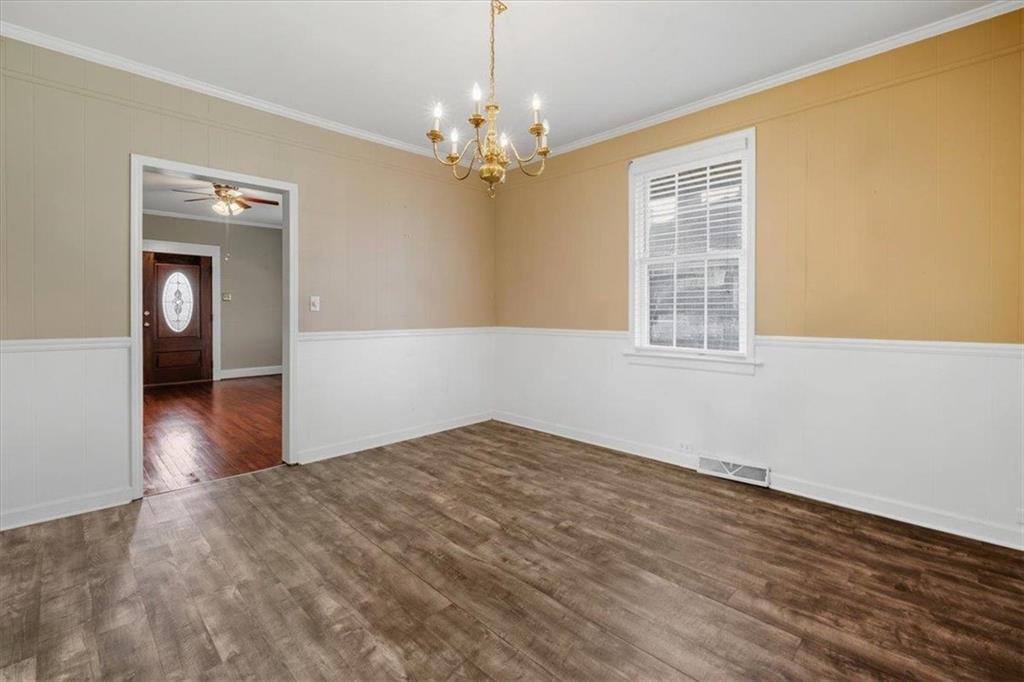 1 Poplar Street Northeast Rome, GA 30161 - Photo 13 of 28 a view of empty room with wooden floor and fan