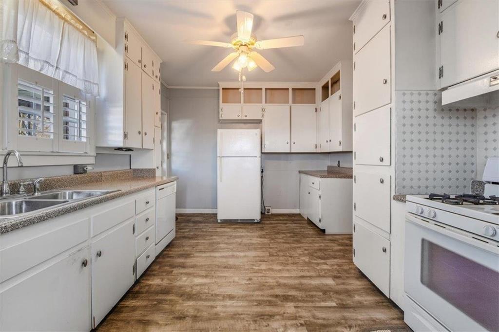 1 Poplar Street Northeast Rome, GA 30161 - Photo 15 of 28 a kitchen with granite countertop a sink stainless steel appliances and cabinets