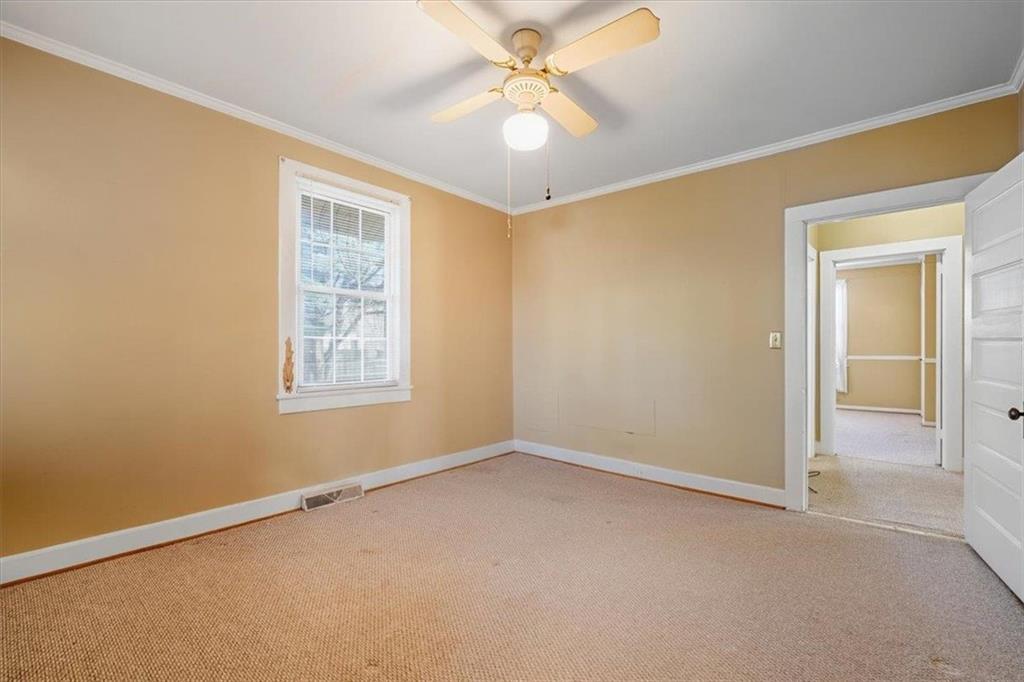 1 Poplar Street Northeast Rome, GA 30161 - Photo 18 of 28 an empty room with windows and fan