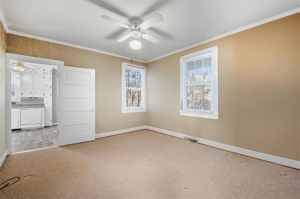 1 Poplar Street Northeast Rome, GA 30161 - Photo 19 of 28 an empty room with windows and fan