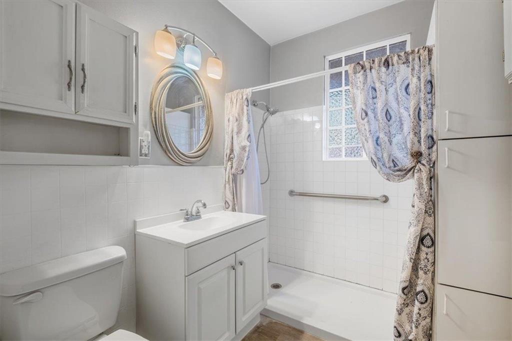 1 Poplar Street Northeast Rome, GA 30161 - Photo 20 of 28 a bathroom with a sink toilet and a mirror