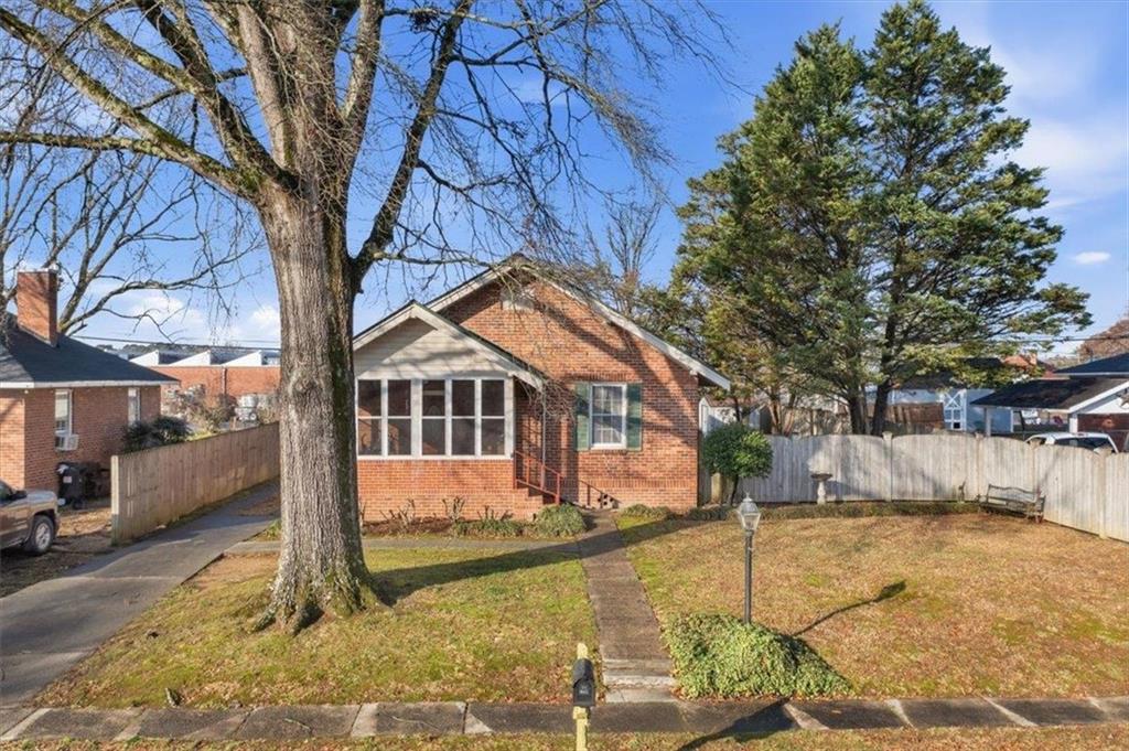1 Poplar Street Northeast Rome, GA 30161 - Photo 2 of 28 a view of a house with a yard covered in snow