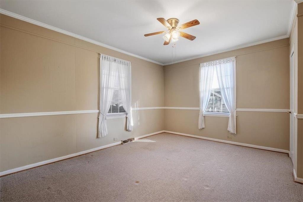 1 Poplar Street Northeast Rome, GA 30161 - Photo 21 of 28 an empty room with windows and chandelier fan