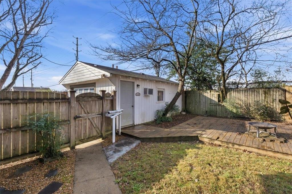 1 Poplar Street Northeast Rome, GA 30161 - Photo 23 of 28 a backyard of a house with barbeque oven table and chairs