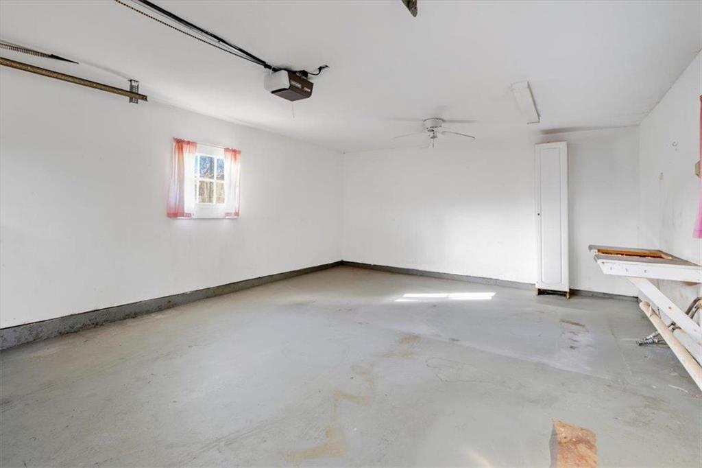 1 Poplar Street Northeast Rome, GA 30161 - Photo 24 of 28 an empty room with a ceiling fan and window