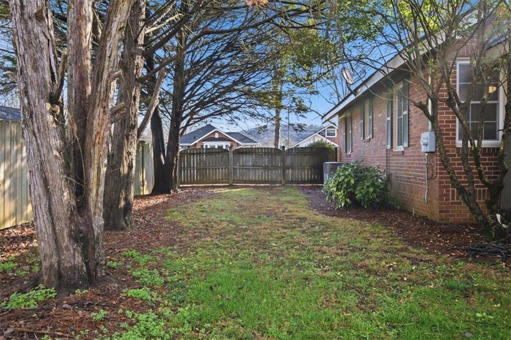 1 Poplar Street Northeast Rome, GA 30161 - Photo 27 of 28 a front view of a house with garden