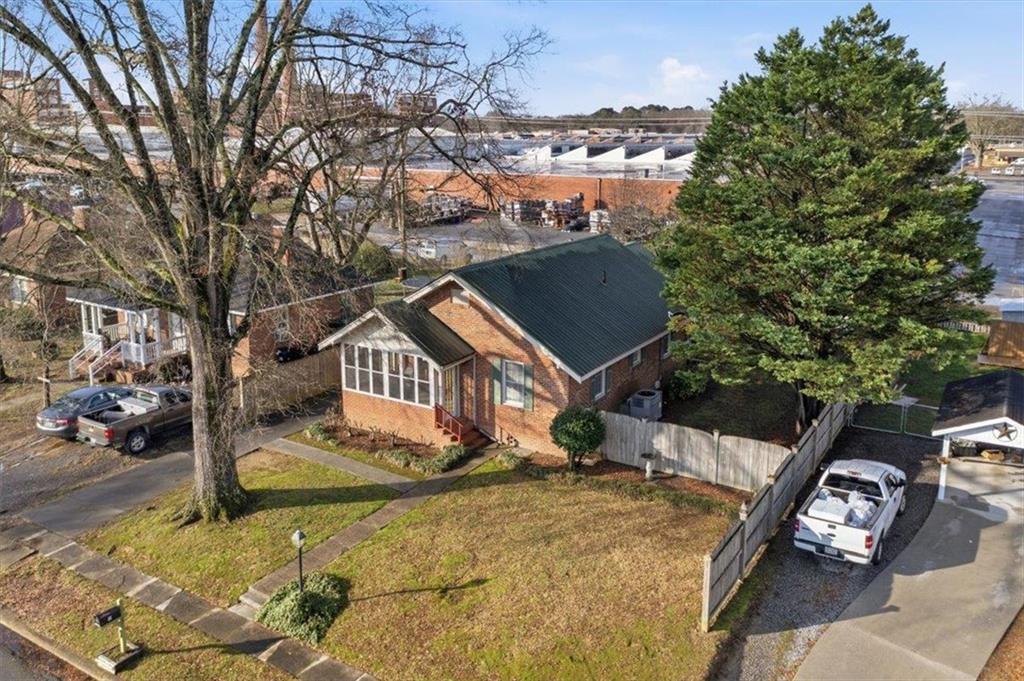 1 Poplar Street Northeast Rome, GA 30161 - Photo 5 of 28 a view of a house with a yard covered in snow