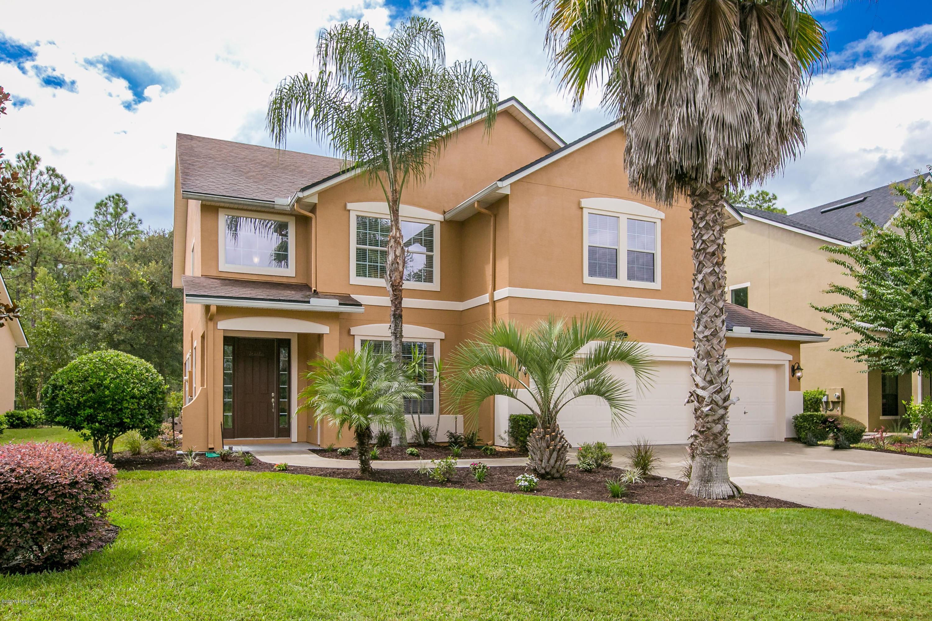 209 North Saxxon Road St. Augustine, FL 32092 - Photo 1 of 59 a front view of a house with a garden and plants
