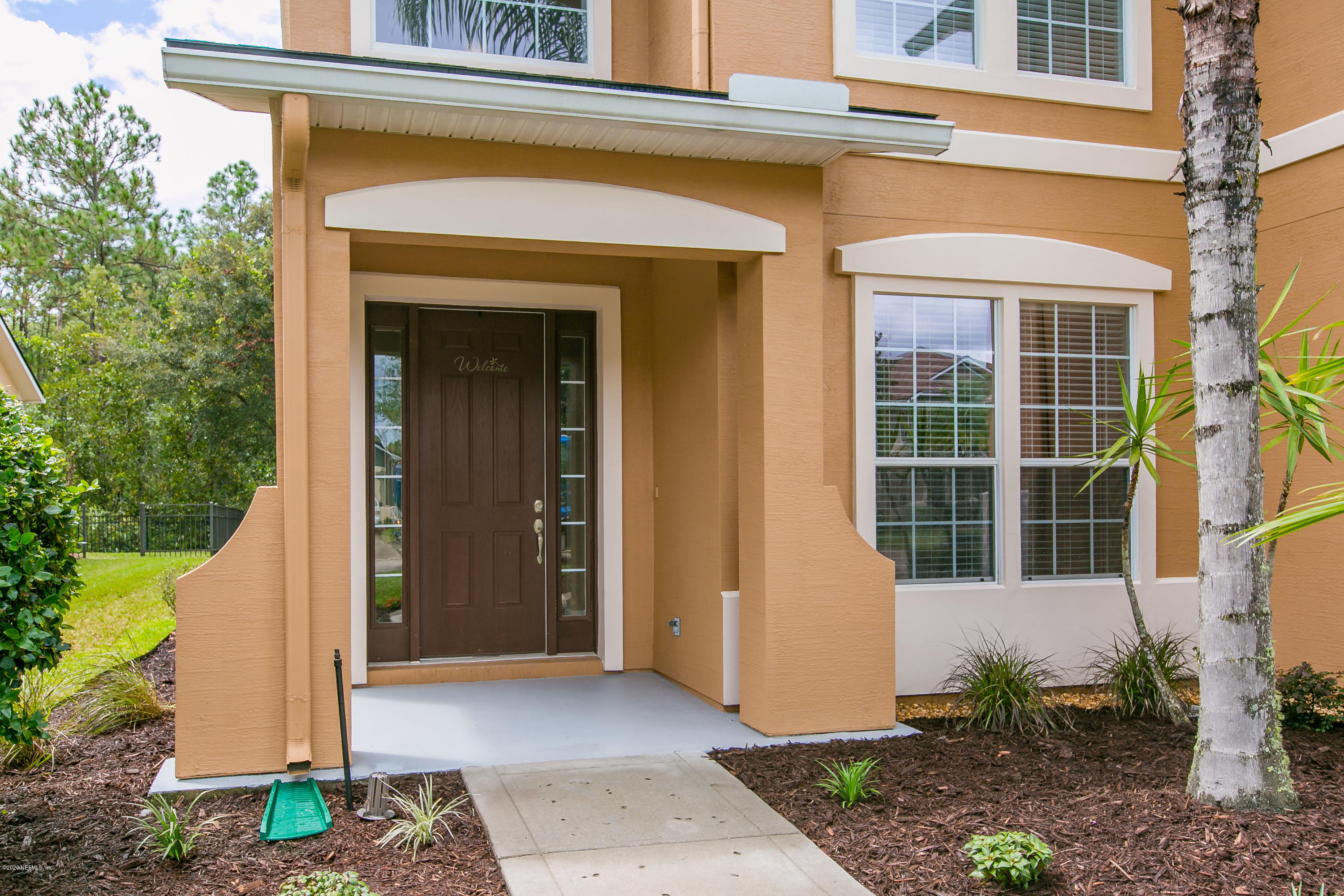 209 North Saxxon Road St. Augustine, FL 32092 - Photo 46 of 59 a front view of a house with a plants