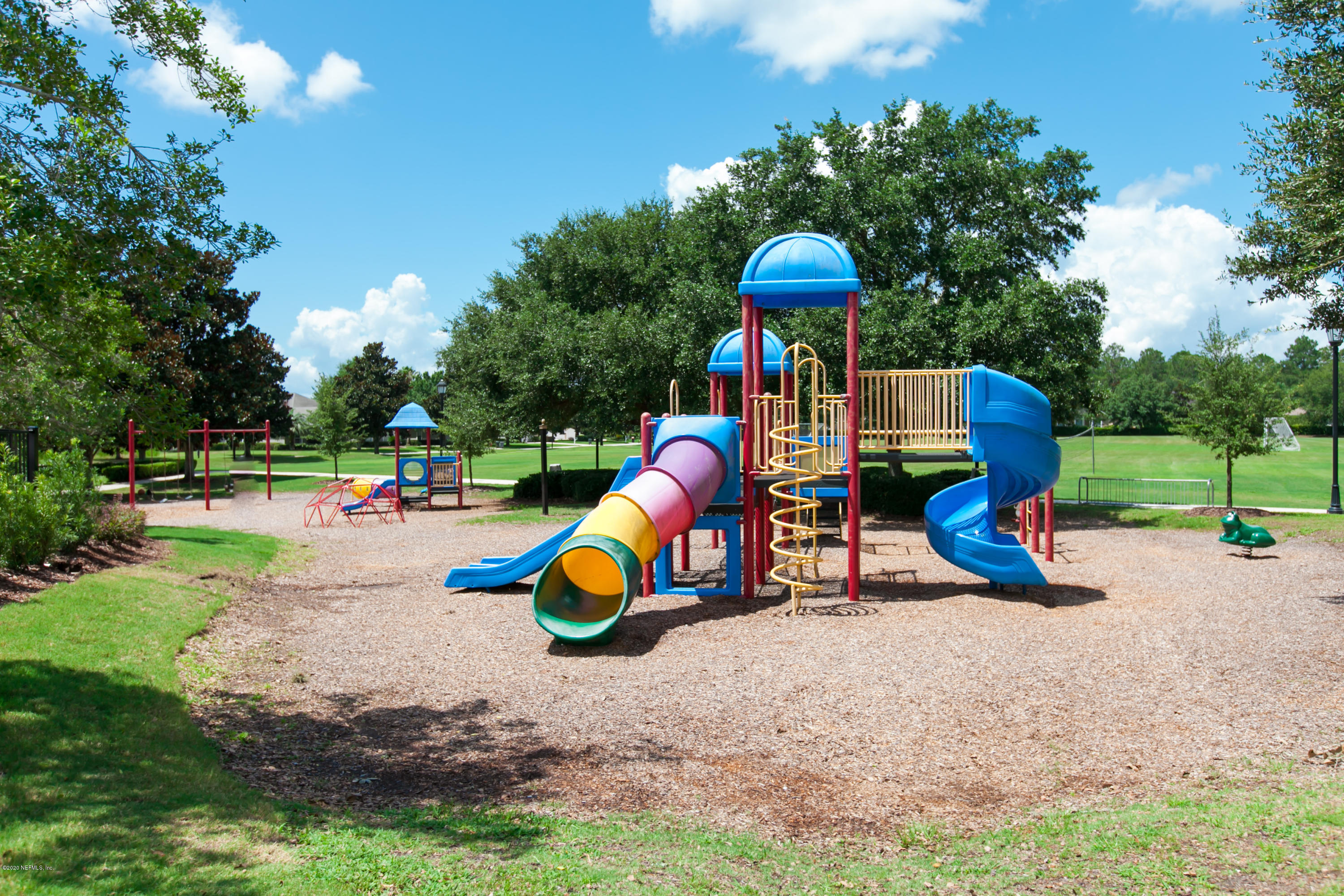 209 North Saxxon Road St. Augustine, FL 32092 - Photo 54 of 59 a childrens park with lots of swings slides and swimming pool