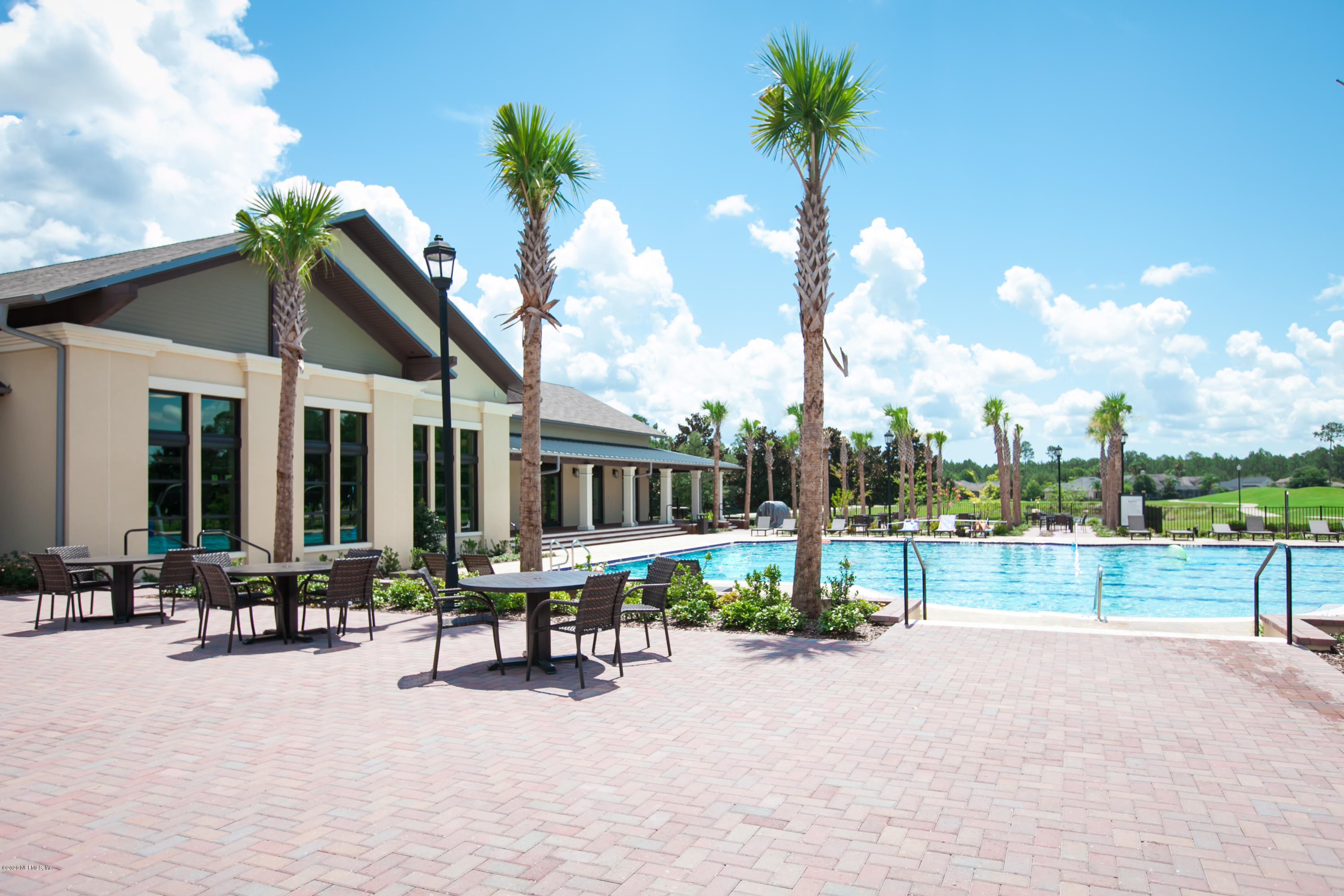 209 North Saxxon Road St. Augustine, FL 32092 - Photo 56 of 59 a view of a house with outdoor seating area