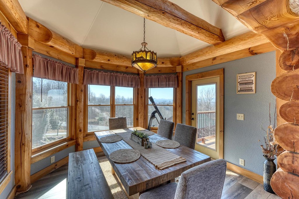 103 Wisteria Drive Murphy, NC 28906 - Photo 12 of 62 a view of a dining room with furniture wooden floor and a chandelier