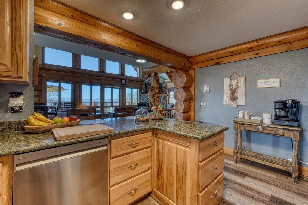 103 Wisteria Drive Murphy, NC 28906 - Photo 15 of 62 a kitchen with granite countertop a sink stove and cabinets