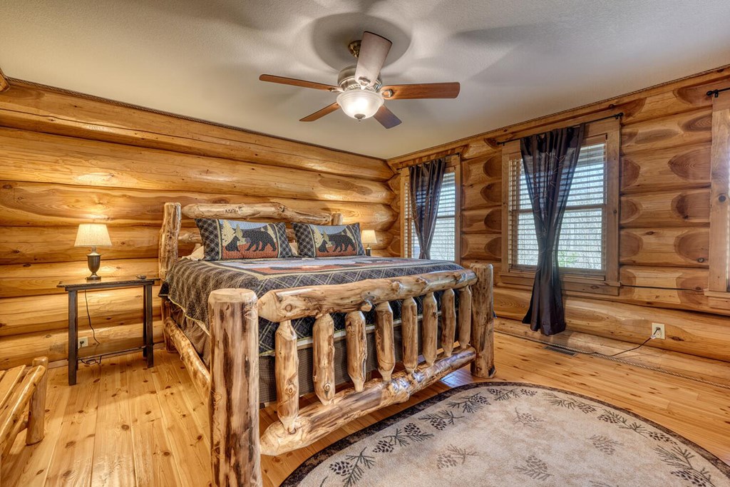 103 Wisteria Drive Murphy, NC 28906 - Photo 16 of 62 a bedroom with a bed and a large window