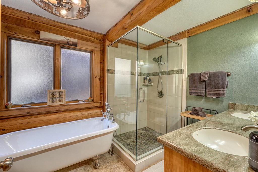 103 Wisteria Drive Murphy, NC 28906 - Photo 18 of 62 a bathroom with a granite countertop sink mirror and bathtub