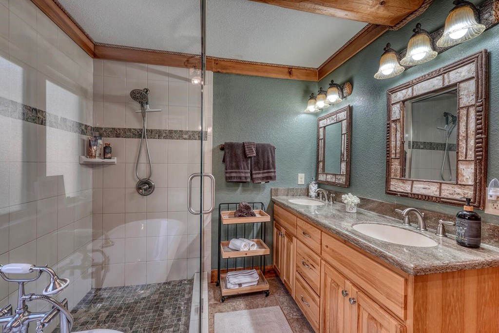 103 Wisteria Drive Murphy, NC 28906 - Photo 19 of 62 a bathroom with a granite countertop sink mirror vanity and toilet