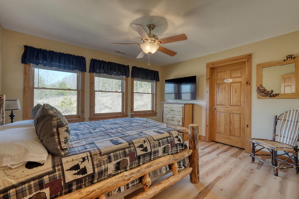 103 Wisteria Drive Murphy, NC 28906 - Photo 27 of 62 a bedroom with a bed a window and dresser