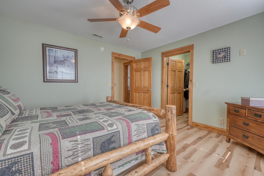 103 Wisteria Drive Murphy, NC 28906 - Photo 30 of 62 a bedroom with a bed and a dresser