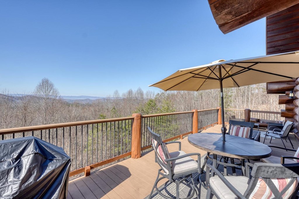 103 Wisteria Drive Murphy, NC 28906 - Photo 4 of 62 a view of balcony with furniture and umbrella