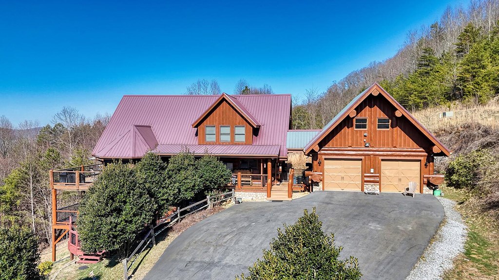 103 Wisteria Drive Murphy, NC 28906 - Photo 52 of 62 a front view of a house with a yard and garage