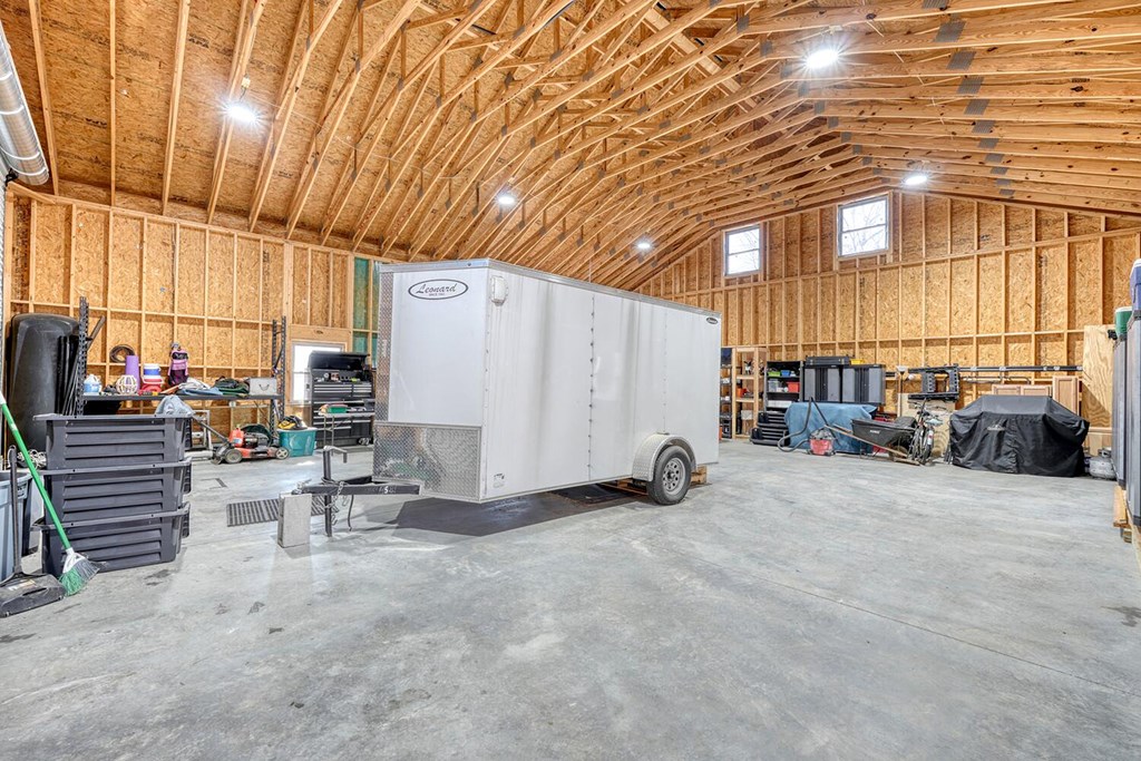 103 Wisteria Drive Murphy, NC 28906 - Photo 55 of 62 a view of a patio with table and chairs and a barbeque