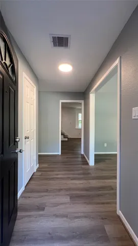 a kitchen with a sink a stove and cabinets