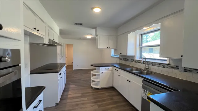 a kitchen with counter top space and appliances