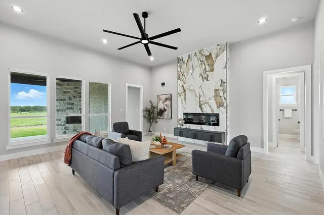 a living room with furniture and a large window