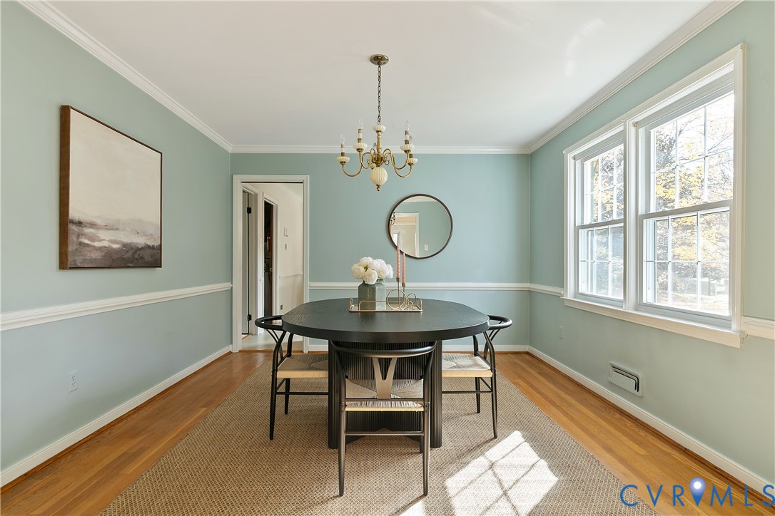 10200 Merrigan Road Richmond, VA 23235 - Photo 16 of 47 a view of a dining room with furniture window and wooden floor