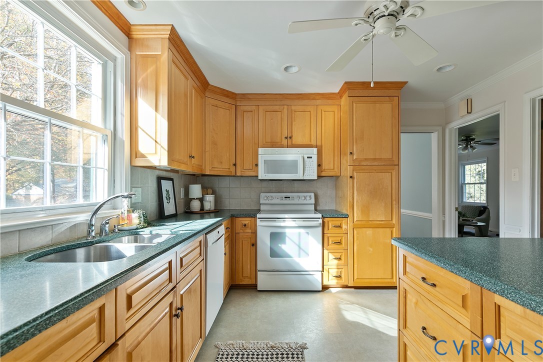 10200 Merrigan Road Richmond, VA 23235 - Photo 22 of 47 a kitchen with stainless steel appliances granite countertop a sink a stove and refrigerator