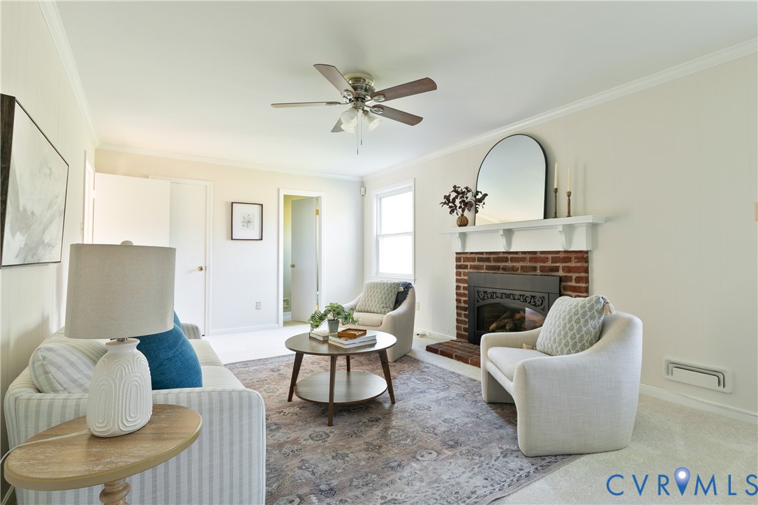 10200 Merrigan Road Richmond, VA 23235 - Photo 25 of 47 a living room with furniture and a fireplace