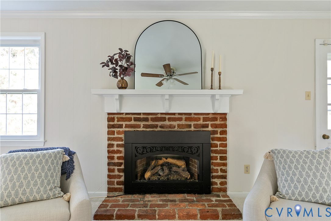 10200 Merrigan Road Richmond, VA 23235 - Photo 26 of 47 a living room with furniture and a fireplace