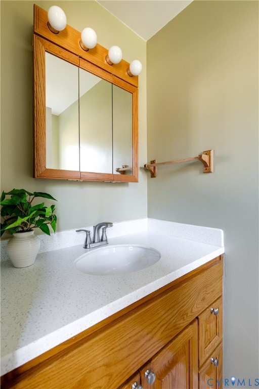 10200 Merrigan Road Richmond, VA 23235 - Photo 27 of 47 a bathroom with a sink and a mirror