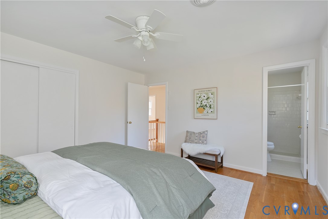 10200 Merrigan Road Richmond, VA 23235 - Photo 31 of 47 a bedroom with a bed and a chandelier