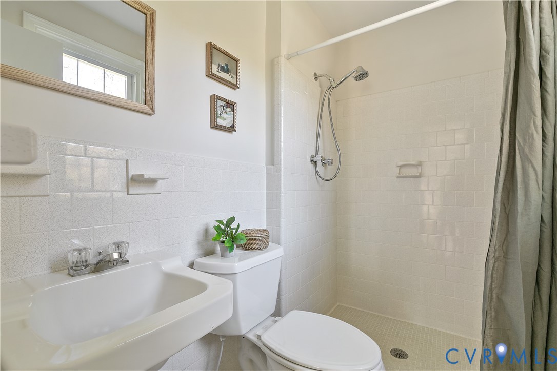 10200 Merrigan Road Richmond, VA 23235 - Photo 32 of 47 a bathroom with a sink toilet and shower