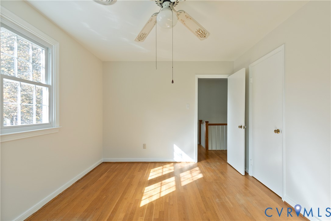 10200 Merrigan Road Richmond, VA 23235 - Photo 35 of 47 a view of an empty room with window and chandelier fan