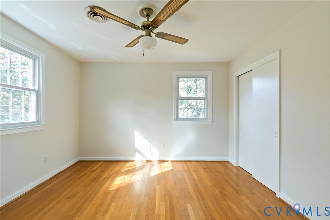 10200 Merrigan Road Richmond, VA 23235 - Photo 39 of 47 wooden floor in an empty room with a window