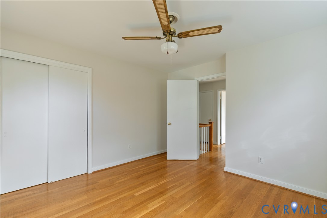 10200 Merrigan Road Richmond, VA 23235 - Photo 40 of 47 a view of a room with wooden floor and a ceiling fan
